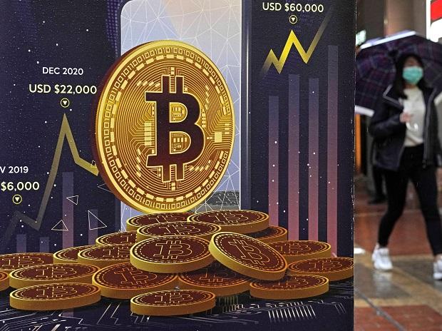 An advertisement for Bitcoin cryptocurrency is displayed on a street in Hong Kong on Feb. 17, 2022. Cryptocurrencies have experienced their worst plunge since 2018. (AP Photo/Kin Cheung, File)