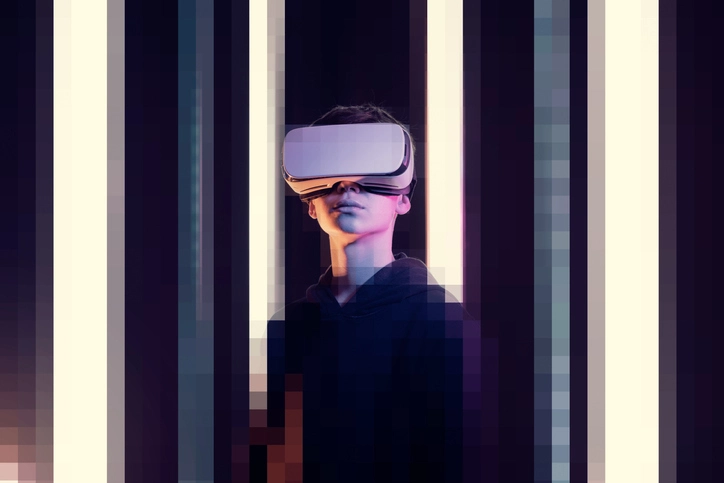 Metaverse investment: A woman wears a virtual reality headset against a pixelated background.